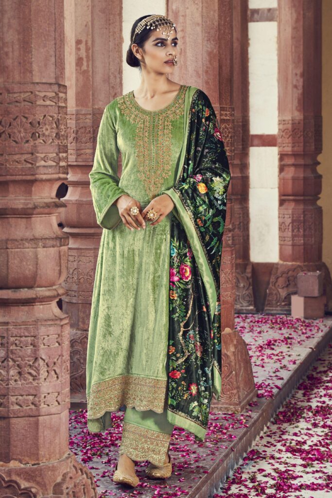 - Elegant green suit with tailored fit, perfect for formal events or special occasions.